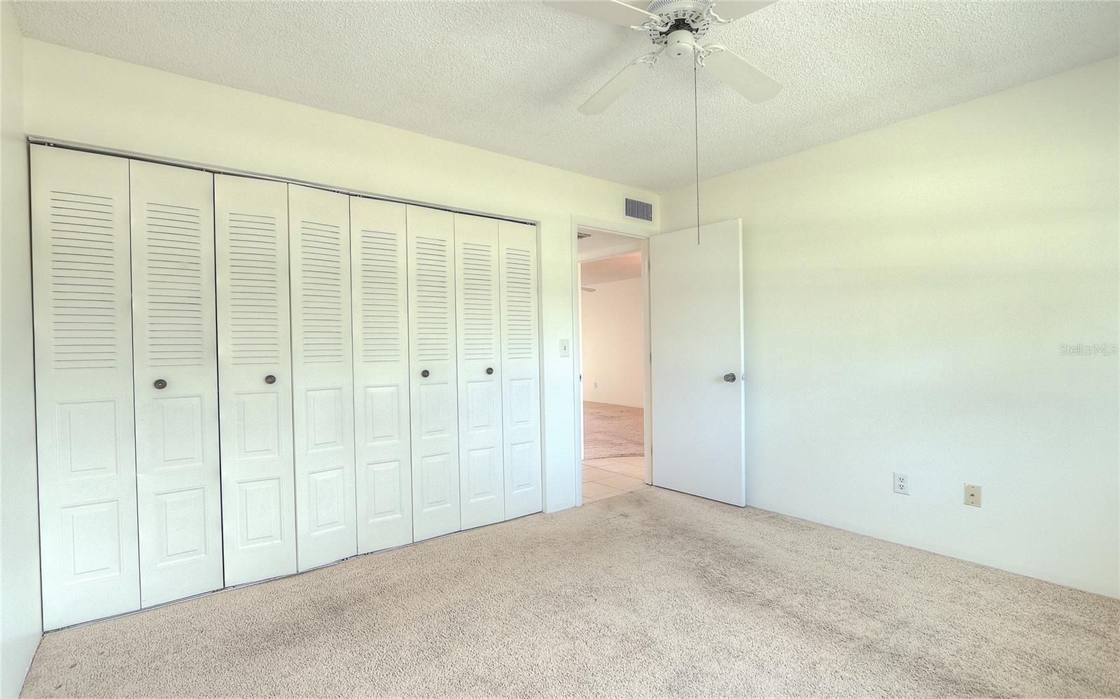 Ver nice size second bedroom with a whole wall of closet space