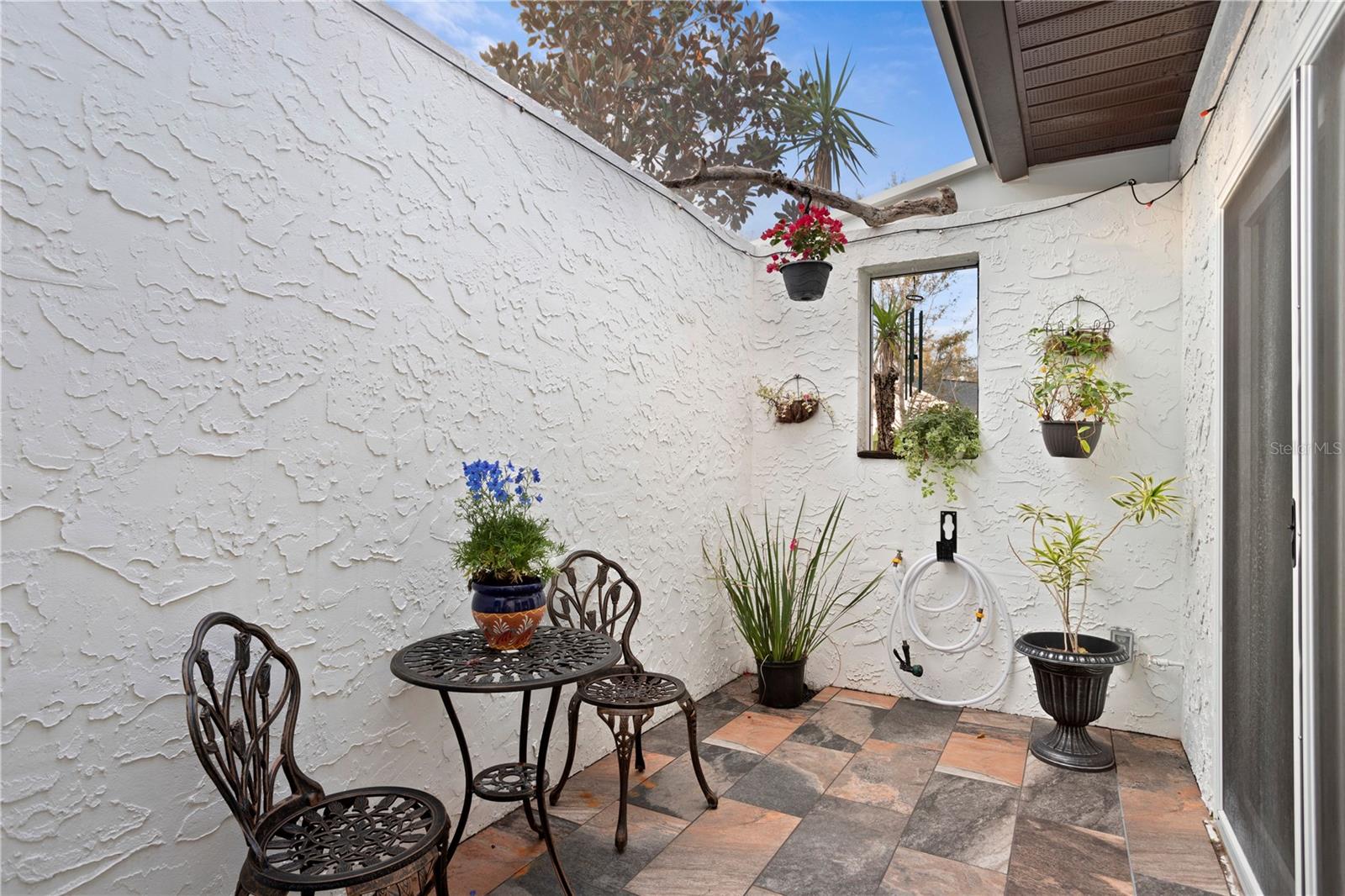 Front courtyard lounge off  front exterior with entry to foyer - bonus entertaining living room .