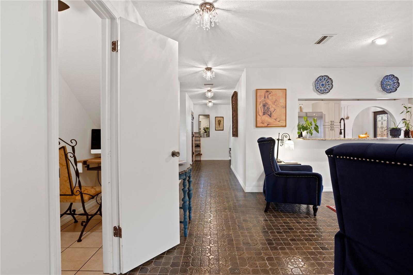 Hallway from dining room to custom built in office / storage room