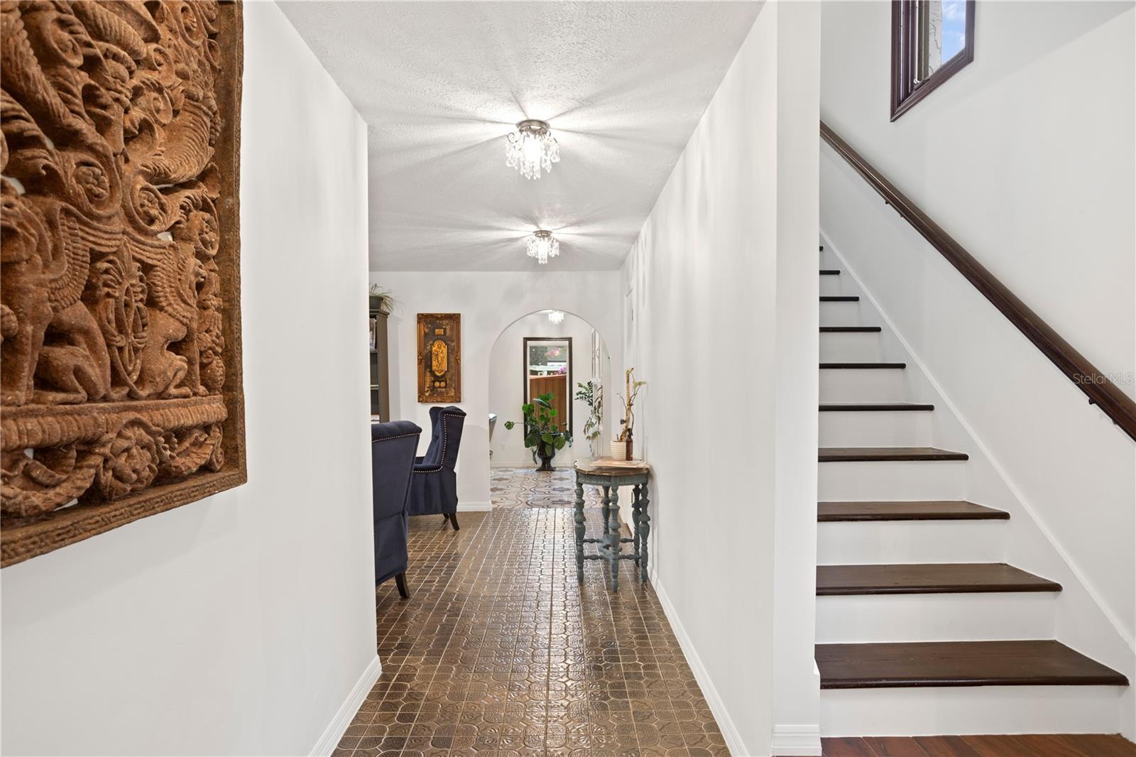 Ascending the hardwood staircase, two expansive guest rooms