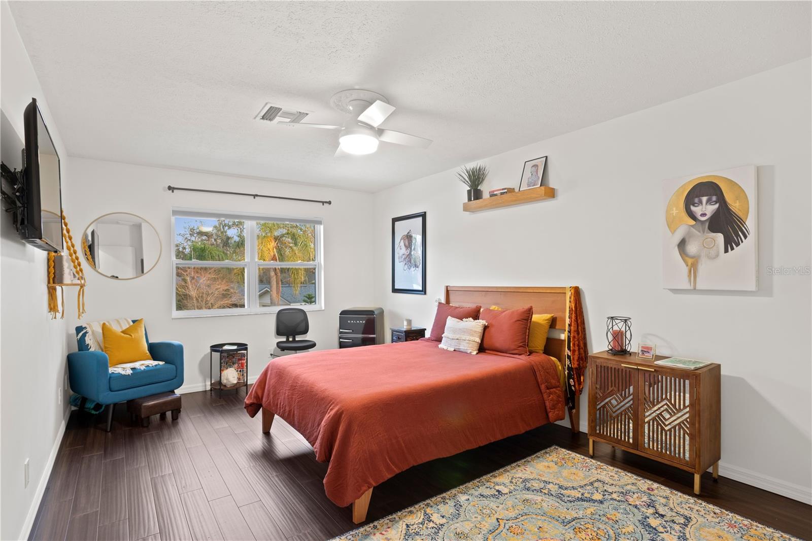 Bedroom 2 with window view to backyard and bamboo floors