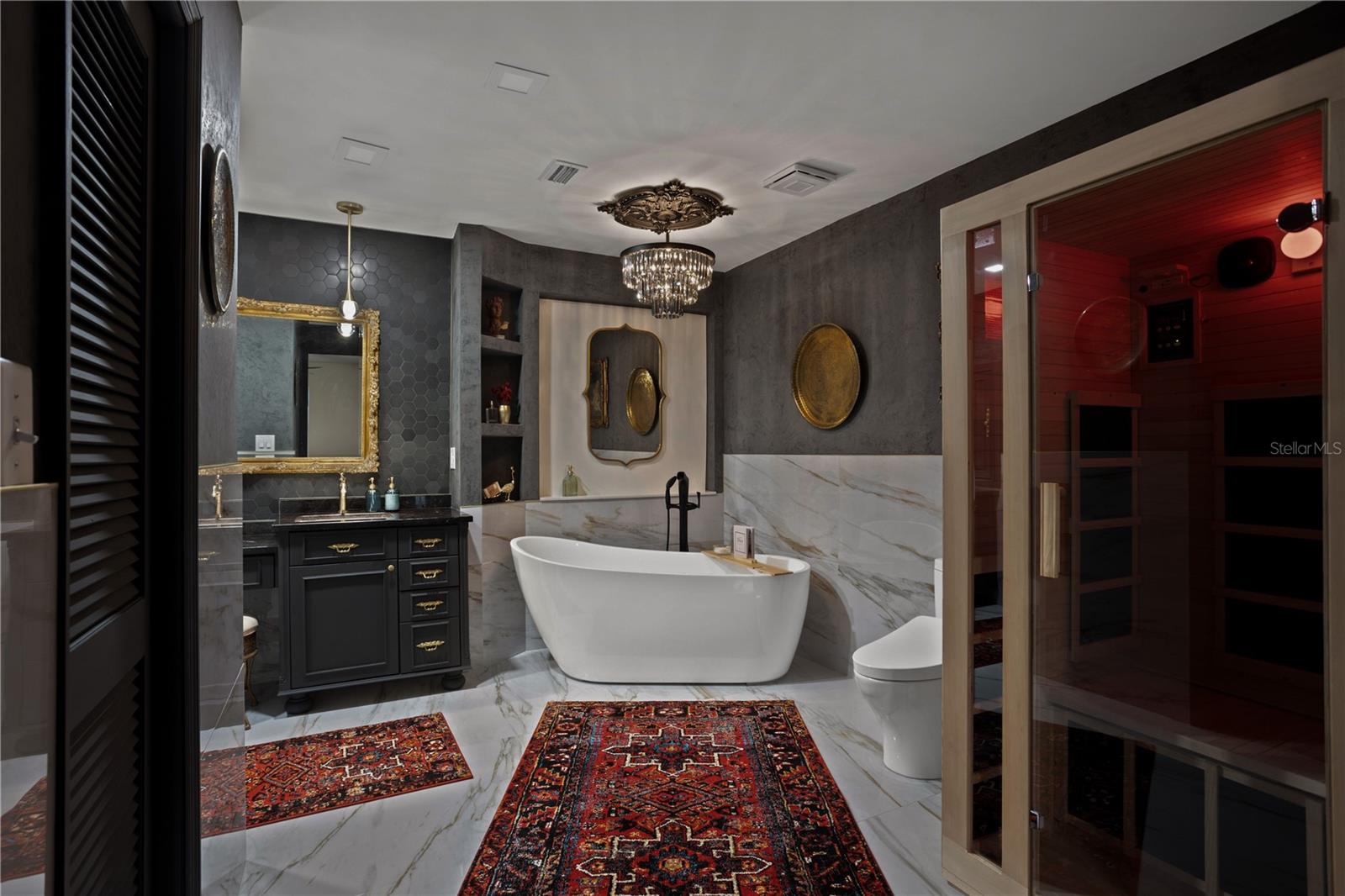 Master bath offers soaking tub, infrared sauna, Toto bidet toilette and custom dual sink vanity .