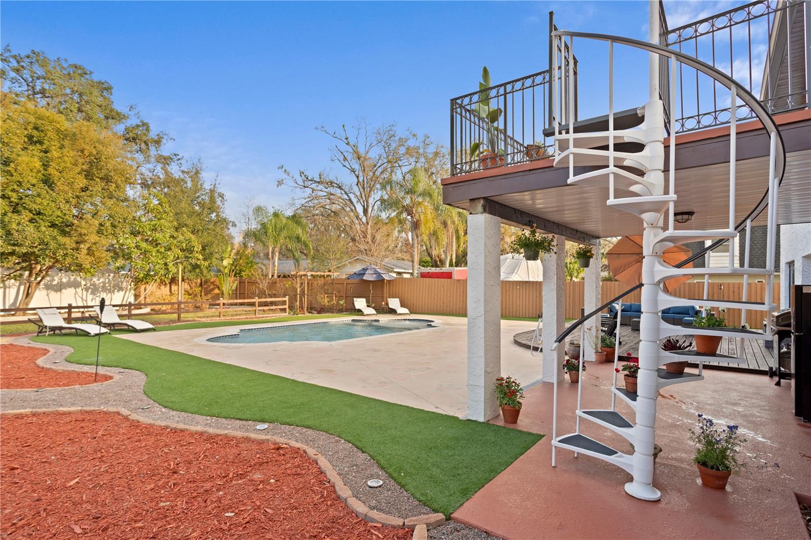 Master en-suite Juliet balcony terrace with spiral staircase to back yard pool deck .