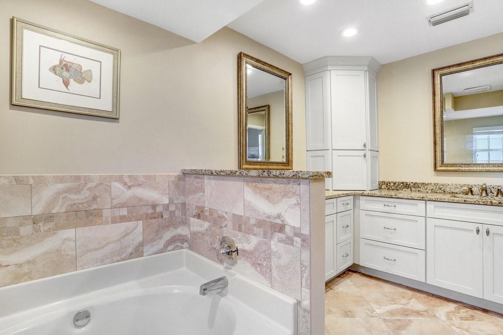 Completely renovated bathroom with new tile, cabinets and granite countertops