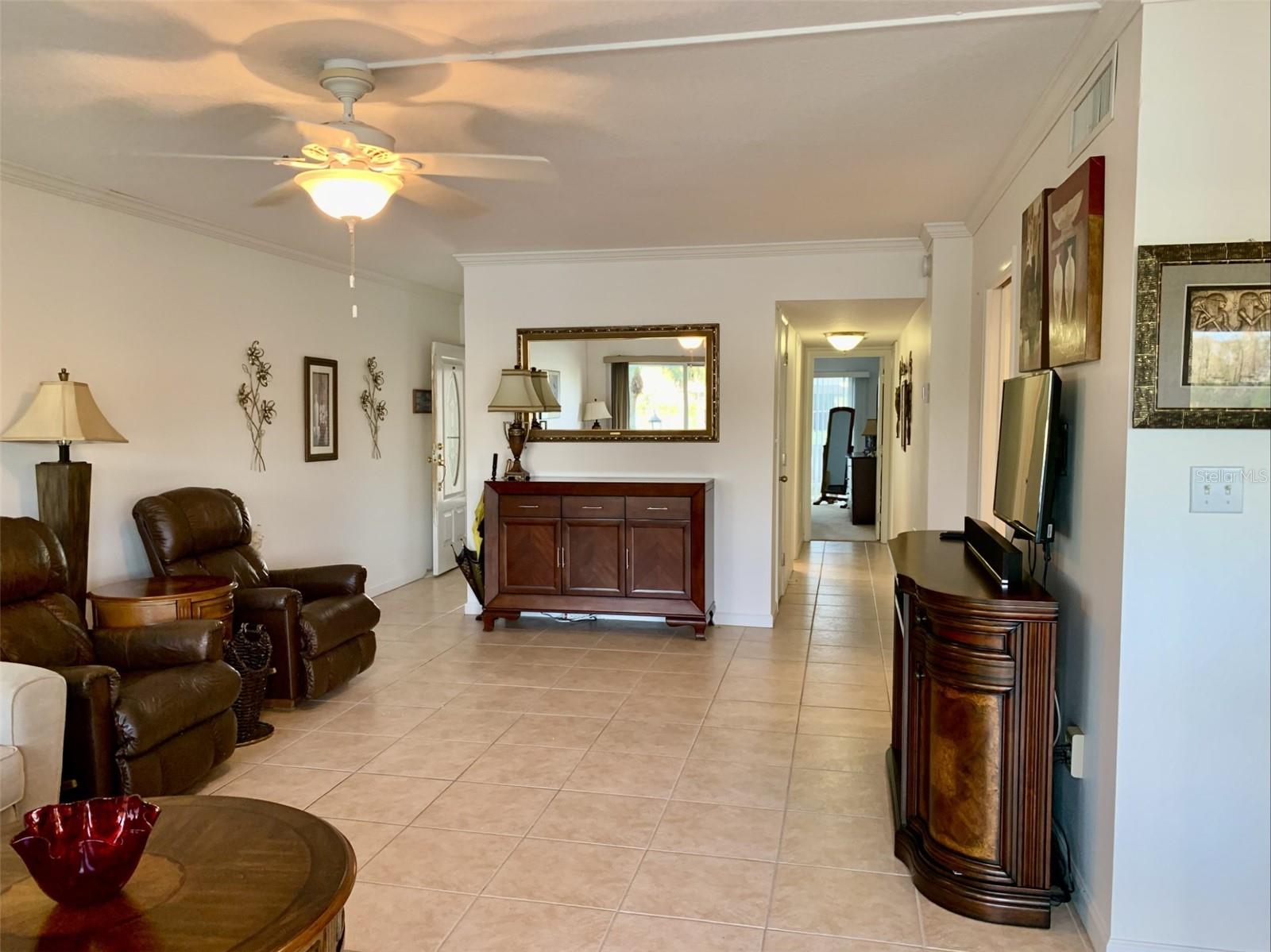 Large great room looking back at foyer and hall to bedrooms