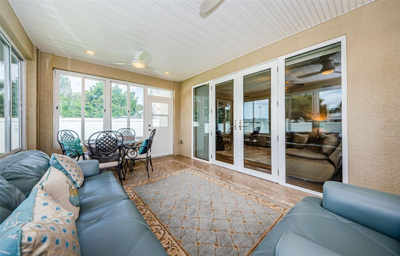 Sunroom Featuring Acrylic Windows & Two Ceiling Fans