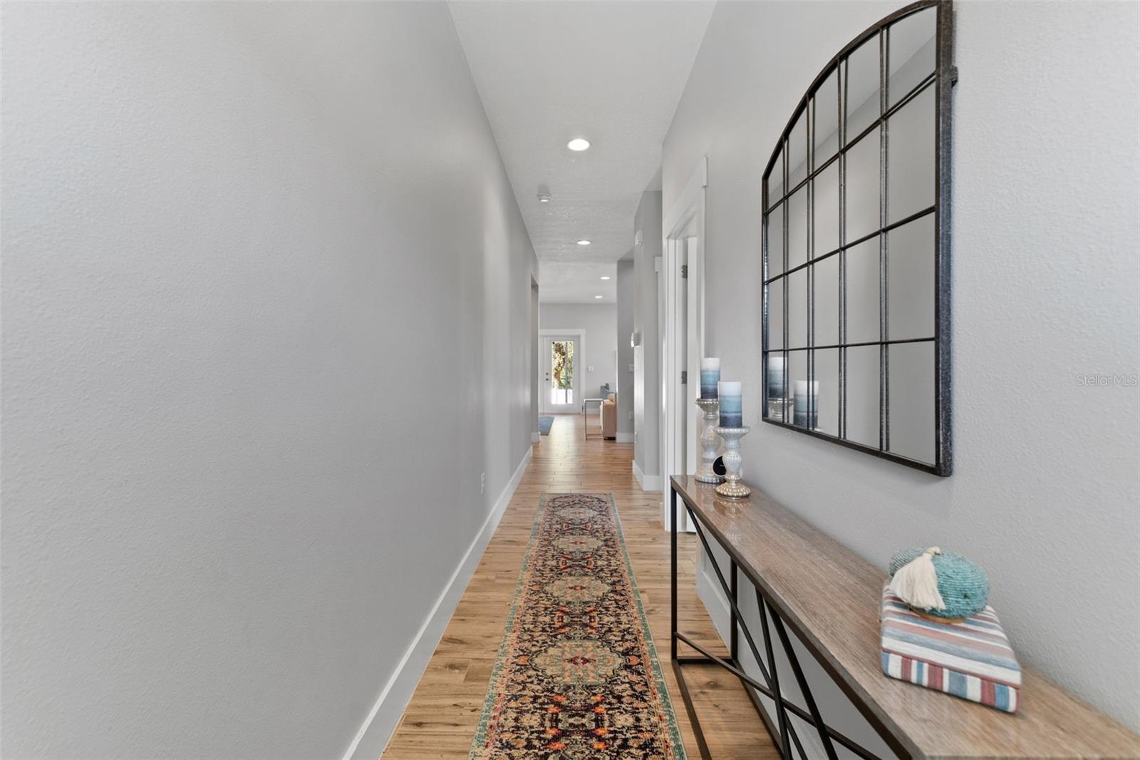 Entry hall with guest bedroom and a full bathroom to the right