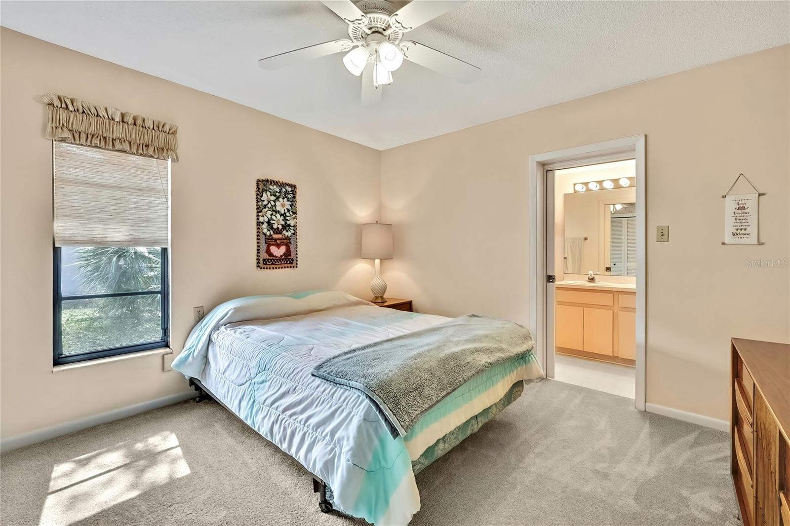 Bedroom 4 with an ensuite bathroom that also serves as the pool bath.