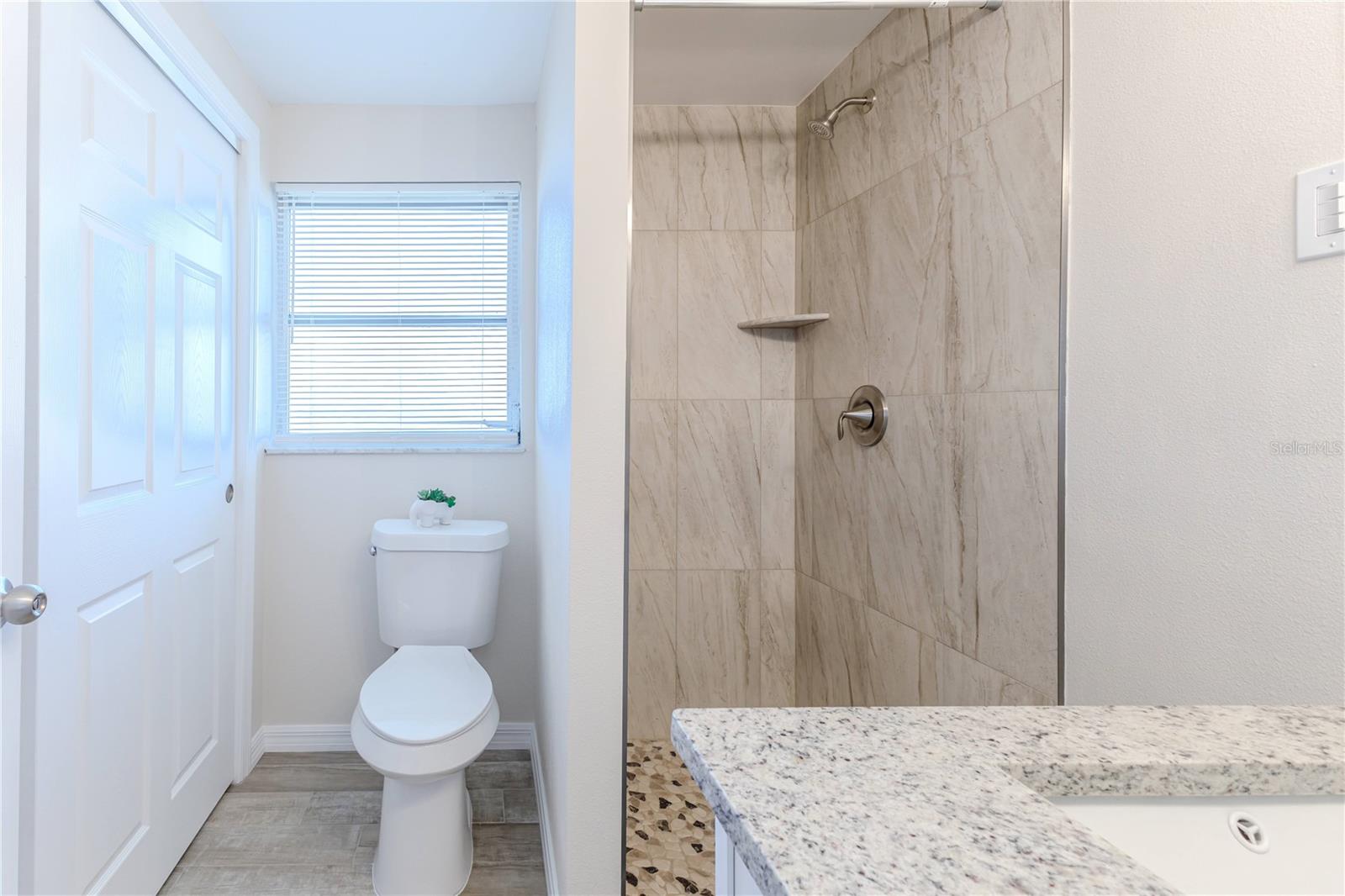 Primary Bathroom with tiled shower