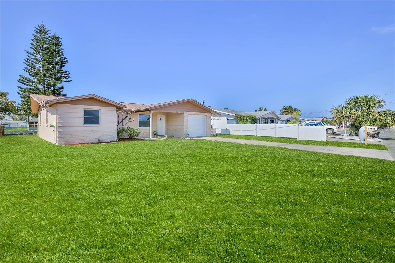 Large yard offers so much space, grass is virtually enhanced.