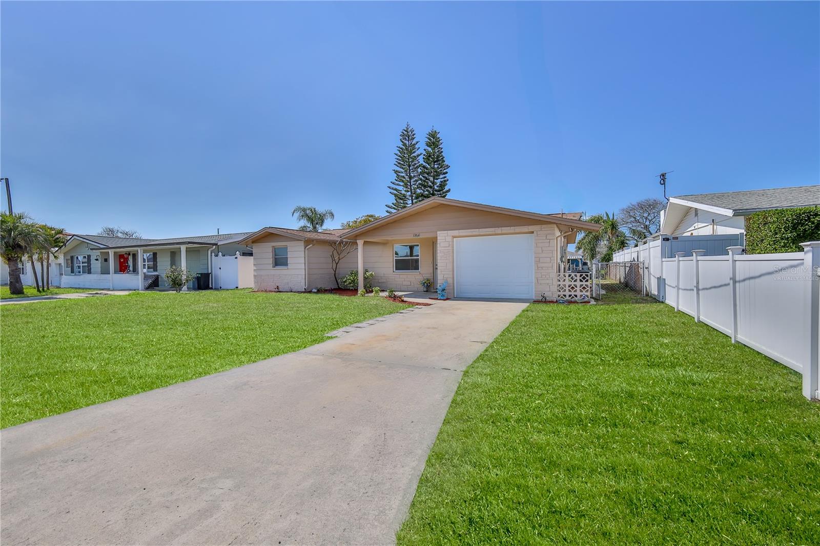 Fenced in yard for your fur babies and young ones! Grass is virtually staged.