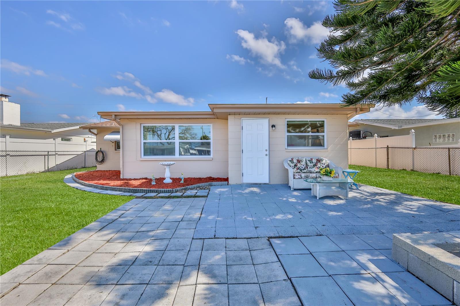 Backyard oasis with so much space and so beautifully landscaped.  Grass is virtually enhanced.