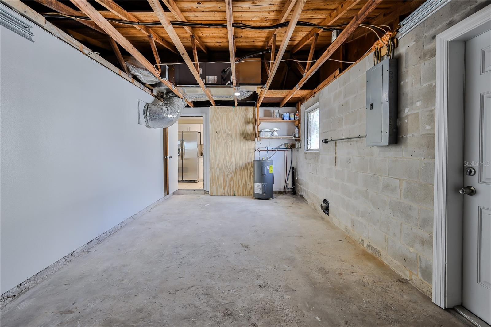 Garage with hook ups for washer and dryer to the right.