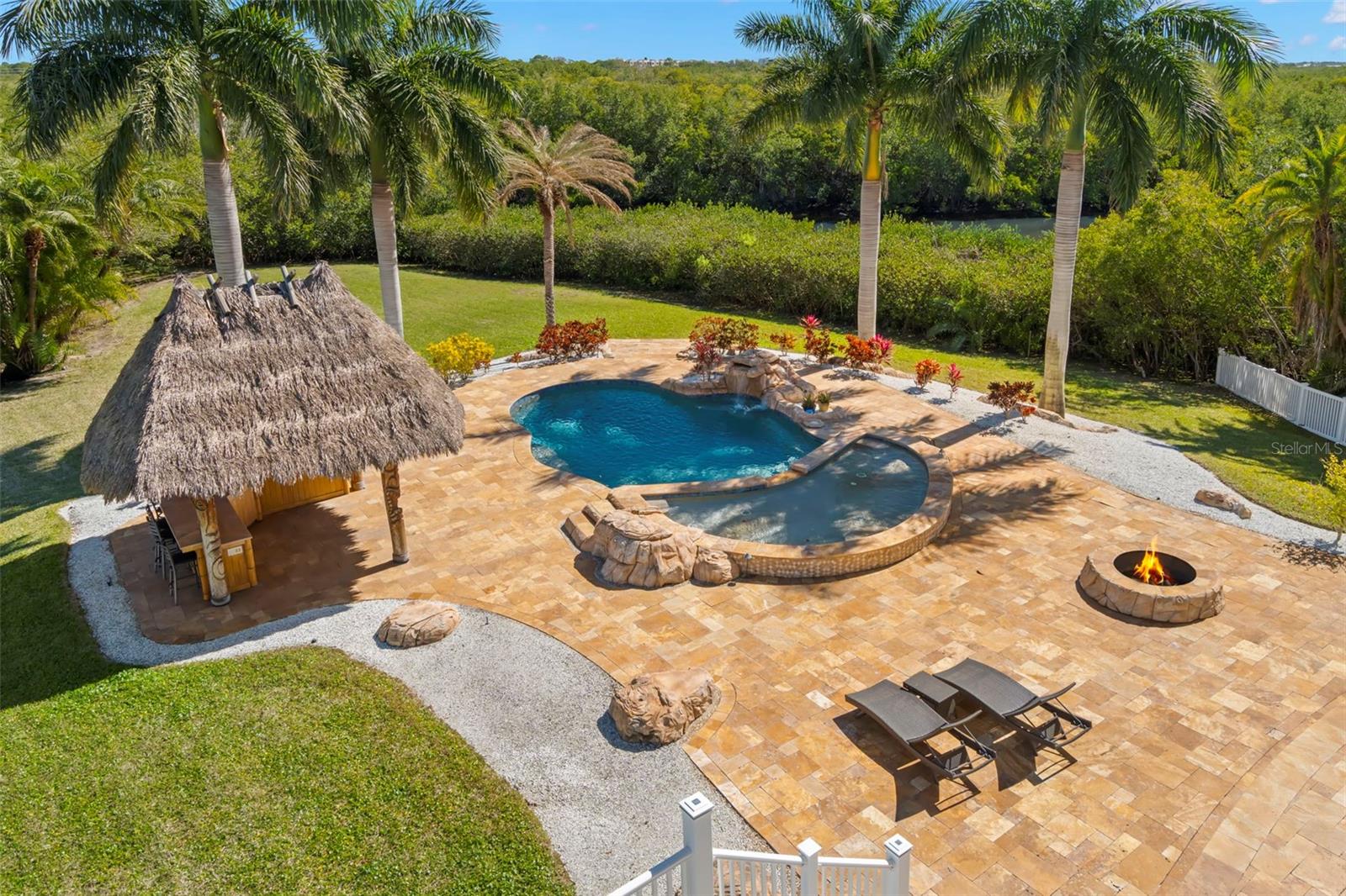 Tropical pool area with Tiki Hut and Bar