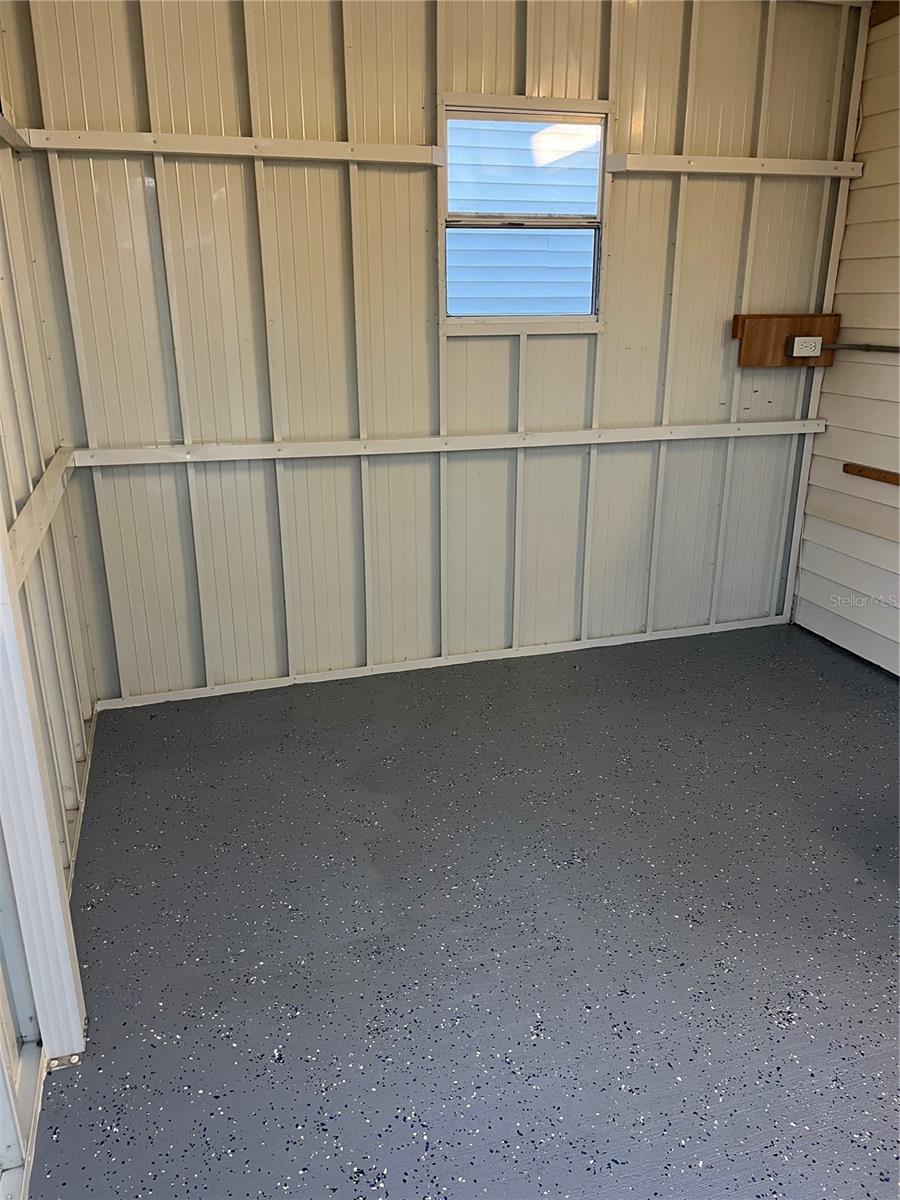 WINDOW IN SHED FOR A/C UNIT