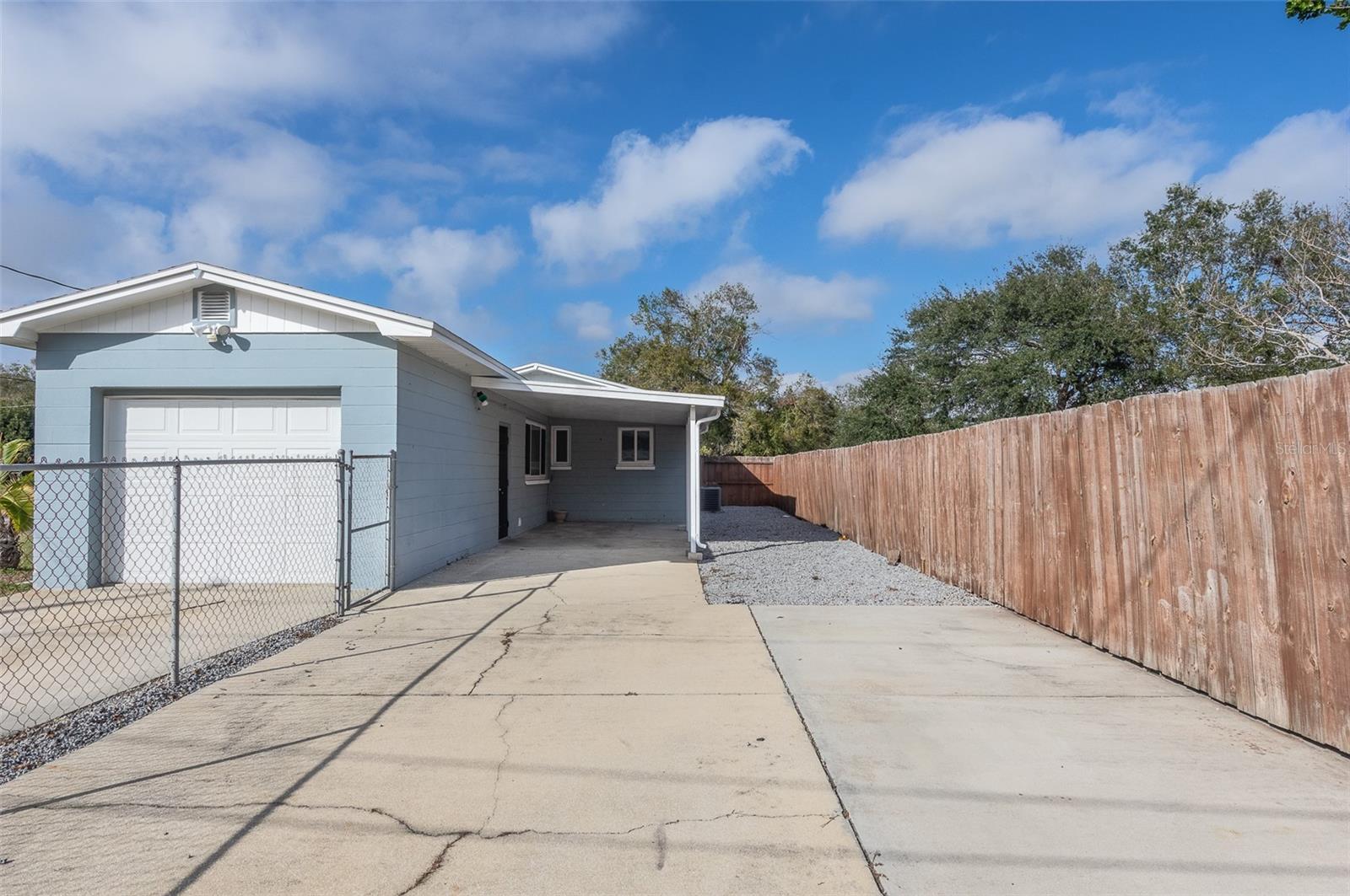 Covered Back Porch/Carport and Fenced in Backyard