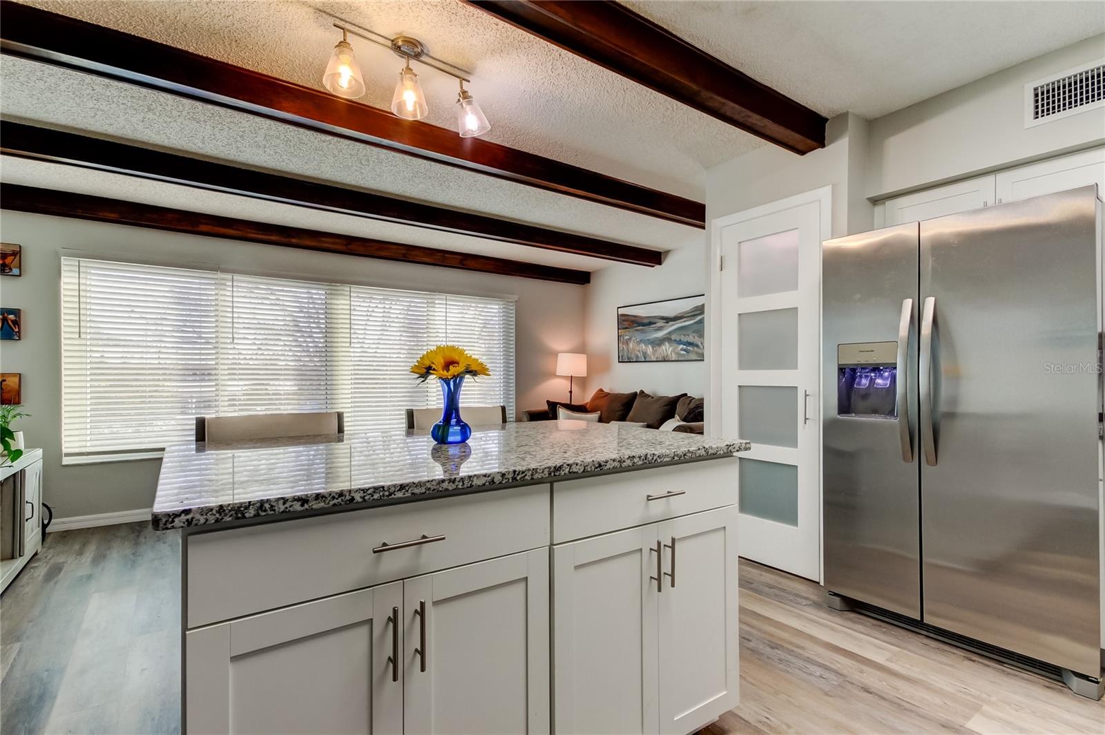 Breakfast Bar separating Kitchen from Family Room