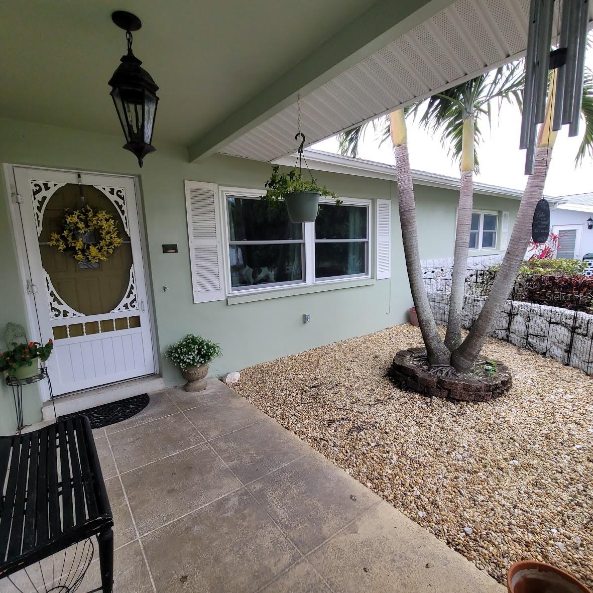 The front entry has a cute courtyard that is gated off.