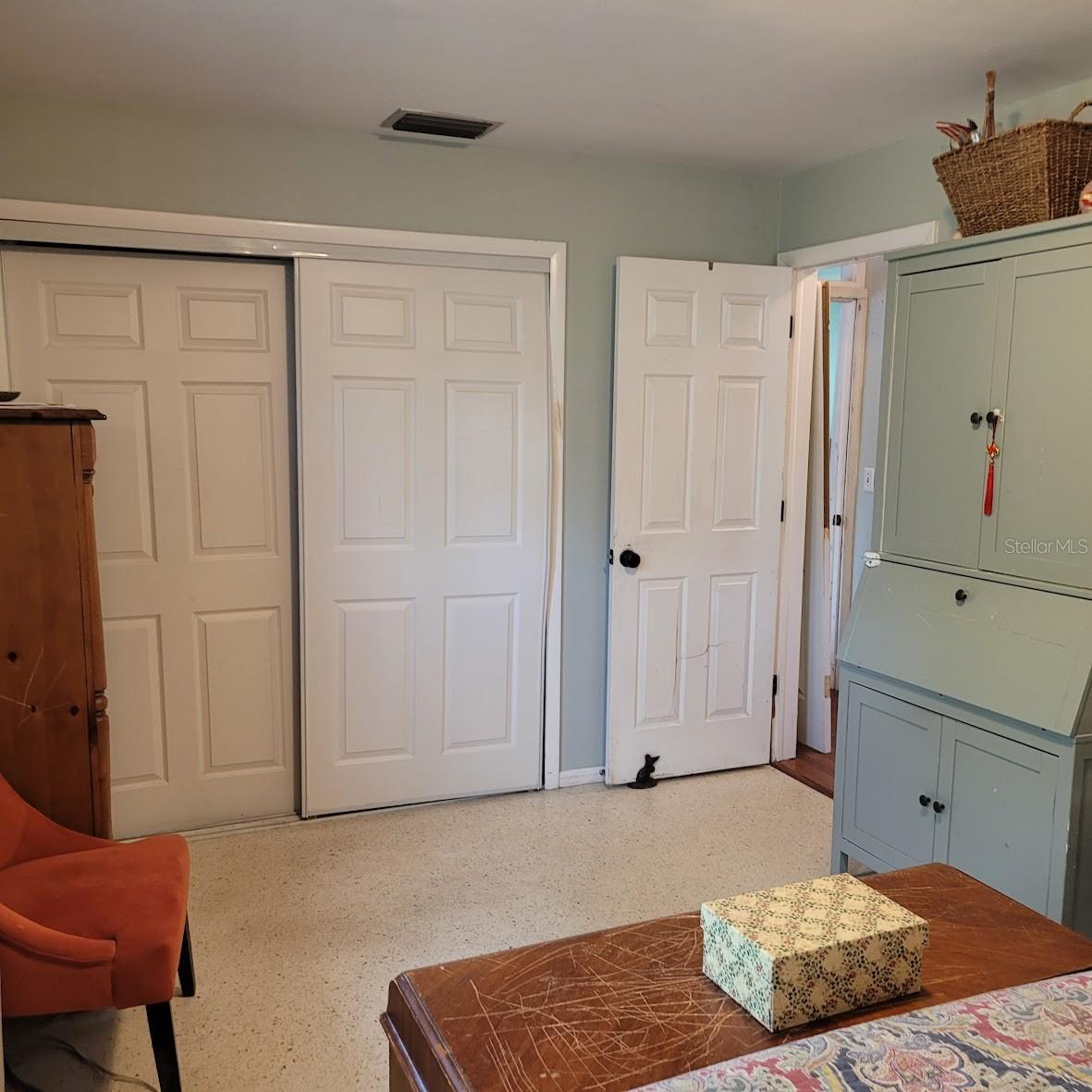 The opposite side of the Primary Bedroom showing the closet and door to the room.