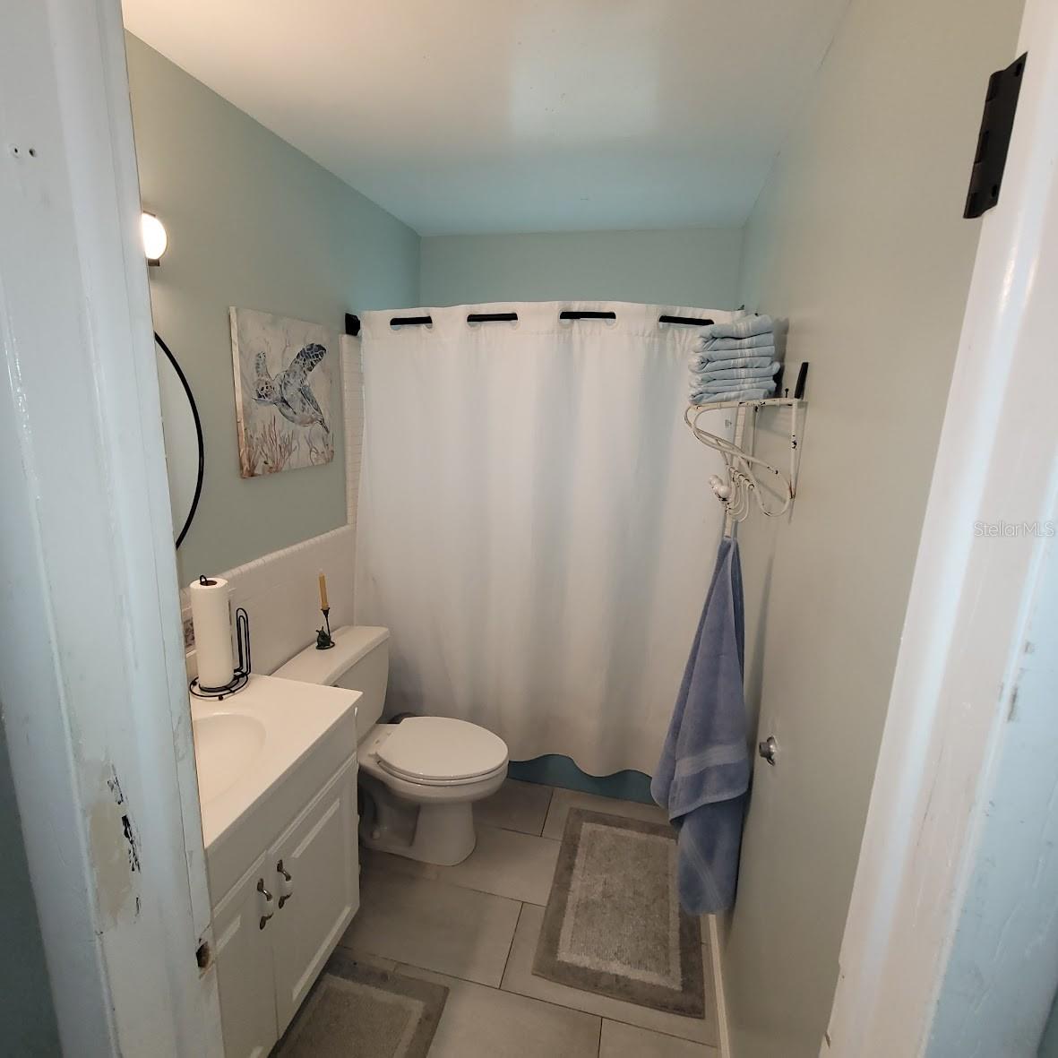 The main bathroom is just outside the 2 bedrooms and has a tub.