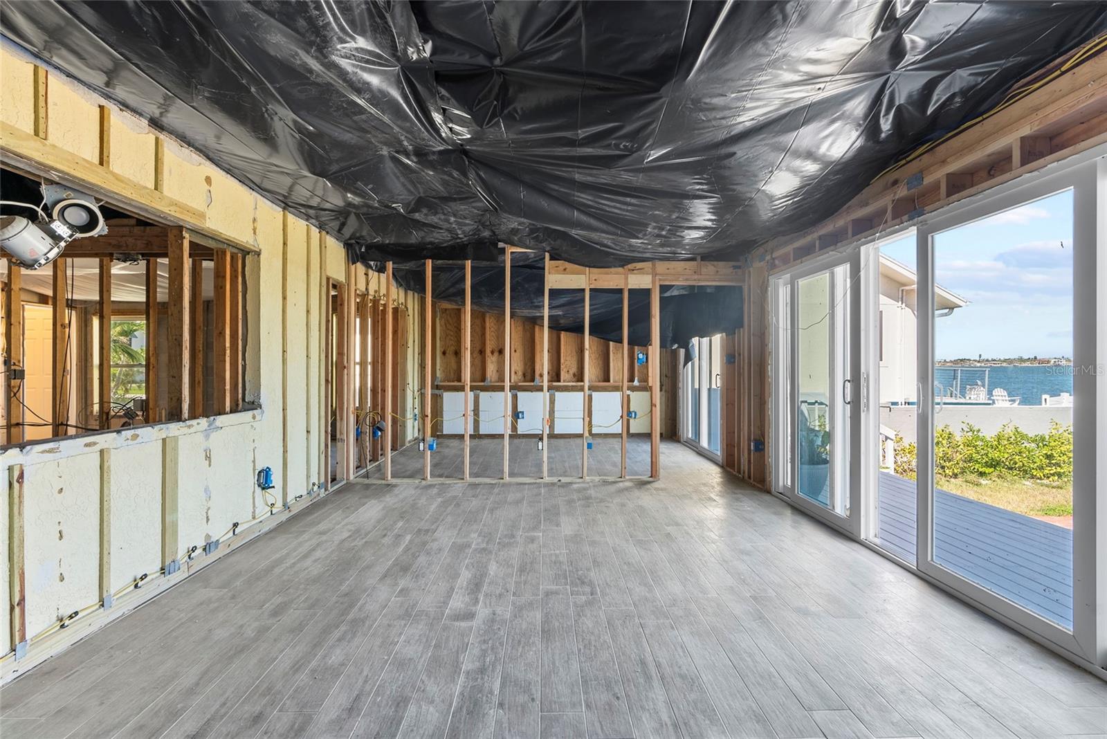 Hurricane Milton tore off the roof of the back porch and left the home exposed to the storm.  The home was professionally remediated to the ceiling