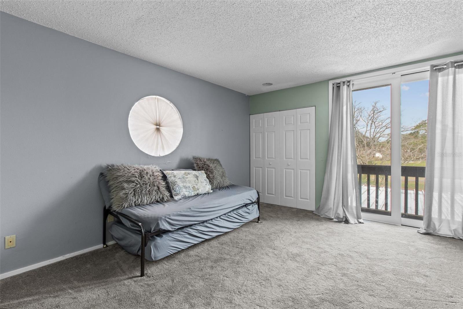 This bedroom also has sliding doors.