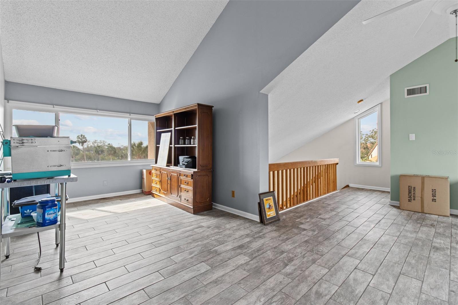 Climb the elegant wood staircase to the second floor, where you'll find ample space perfect for a second primary bedroom, office, den, or playroom—offering versatility to suit your needs.