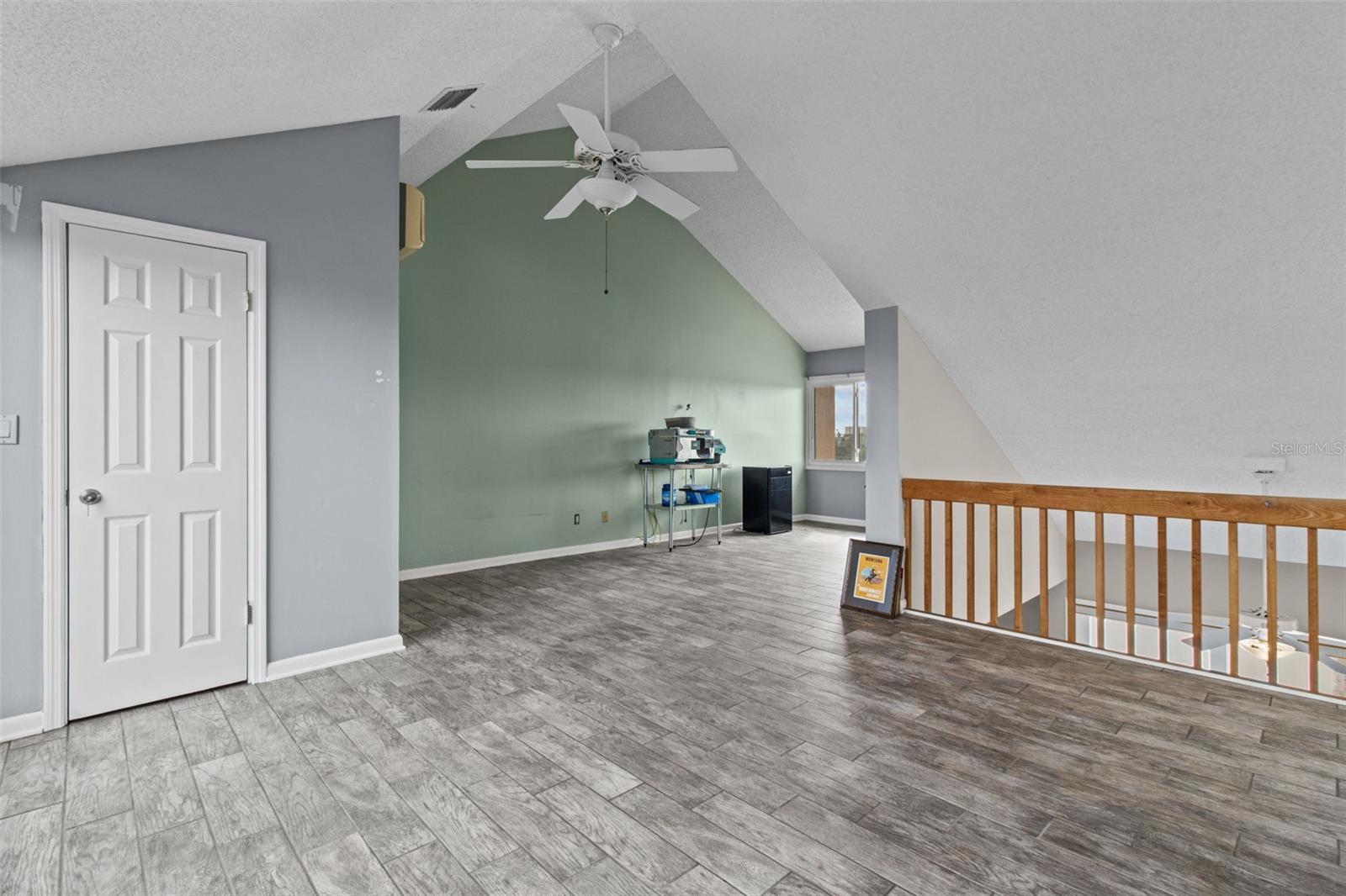 This upstairs room features a walk in closet.