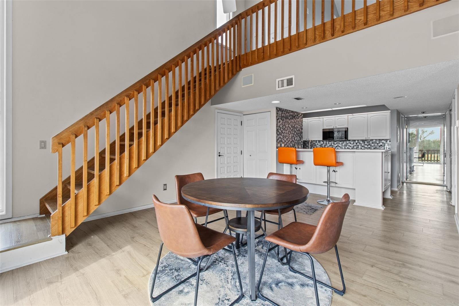 The open layout is perfect for entertaining, with the kitchen effortlessly flowing into the dining area, creating a seamless and inviting space for gatherings.