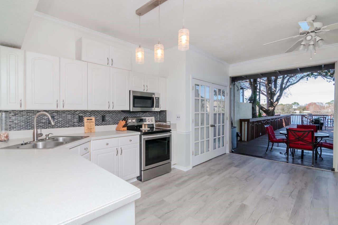 View of kitchen and sliders to outdoor area