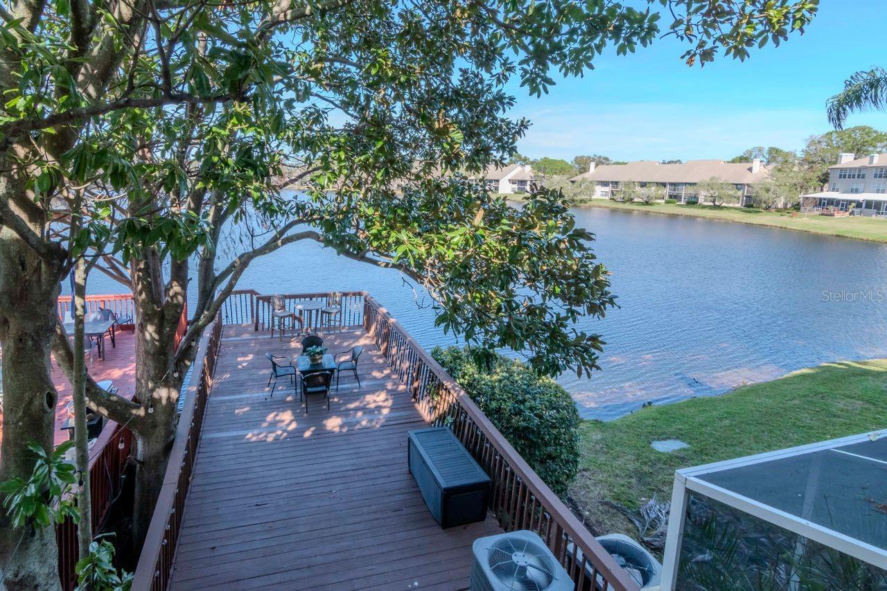 Aerial view of dock/deck and large pond.