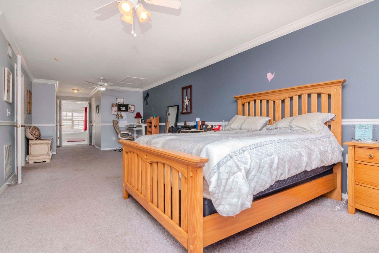 Primary bedroom an ensuite with dual closets and private balcony.