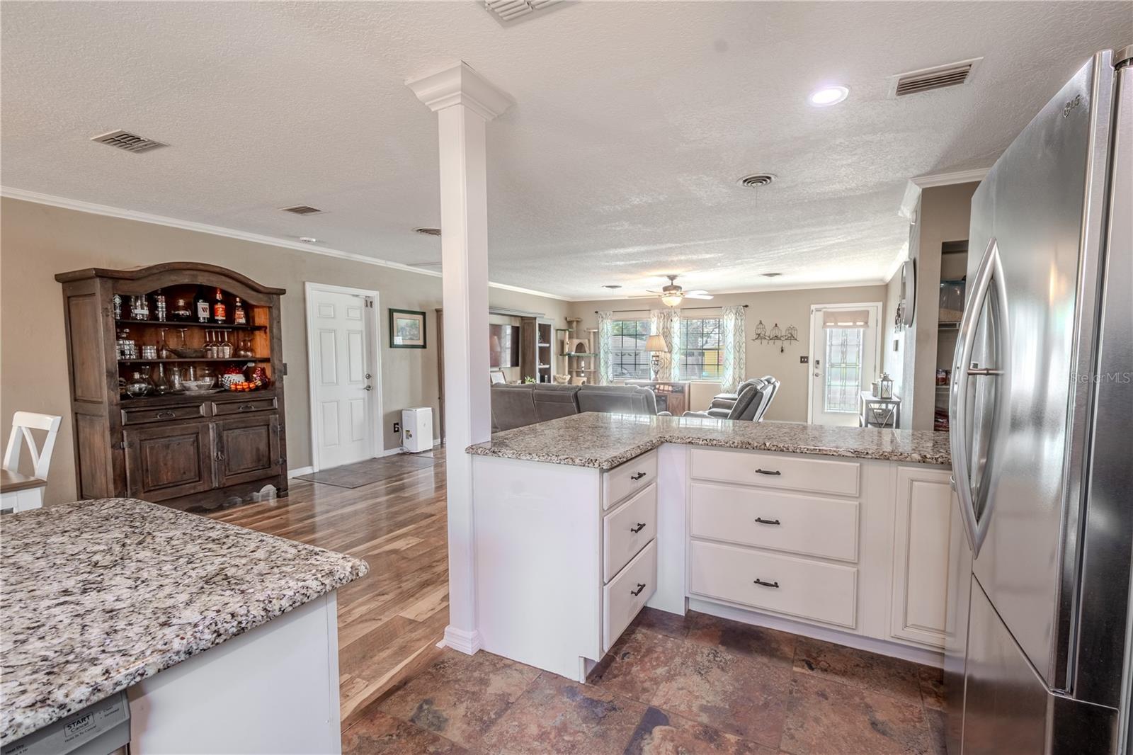 The kitchen features solid wood cabinets with soft close drawers and doors.