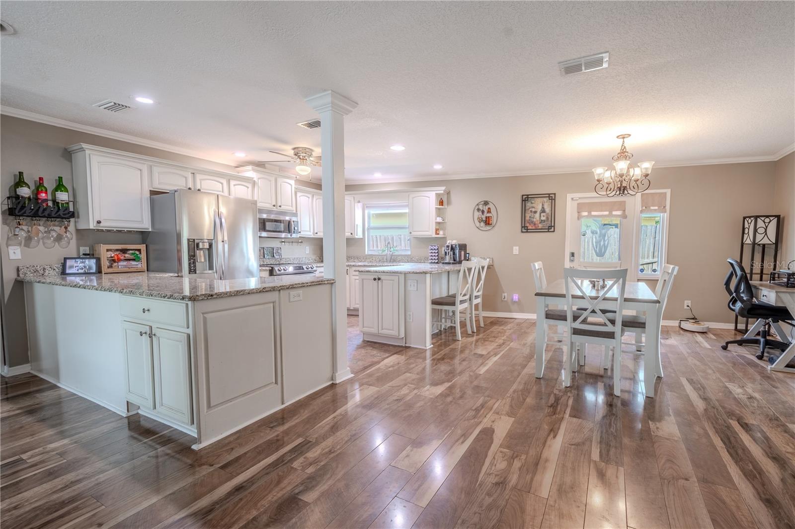 The living room is open to the kitchen and dining room.