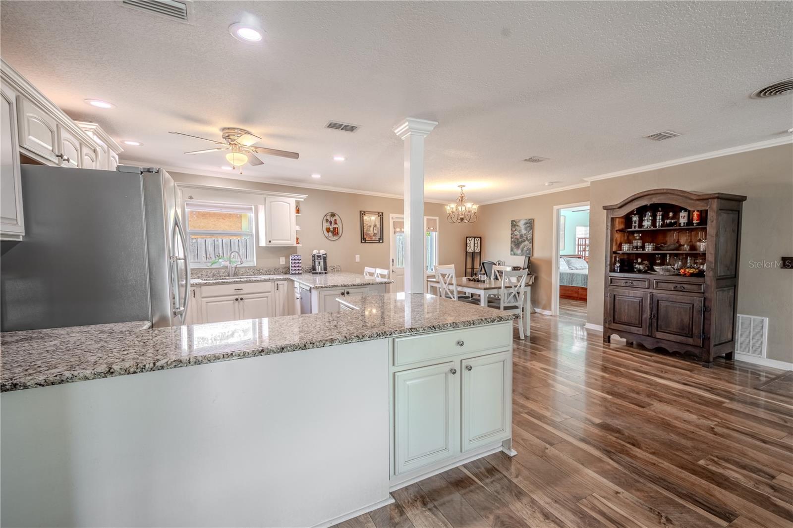 The kitchen features an abundance of granite counter space.