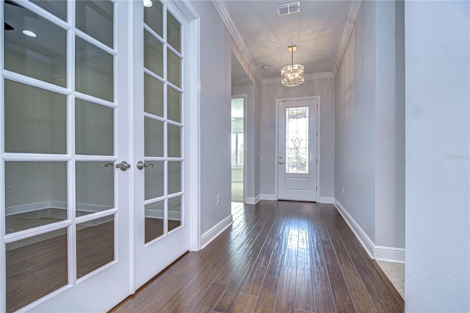 Foyer features statement lighting and statement lighting!