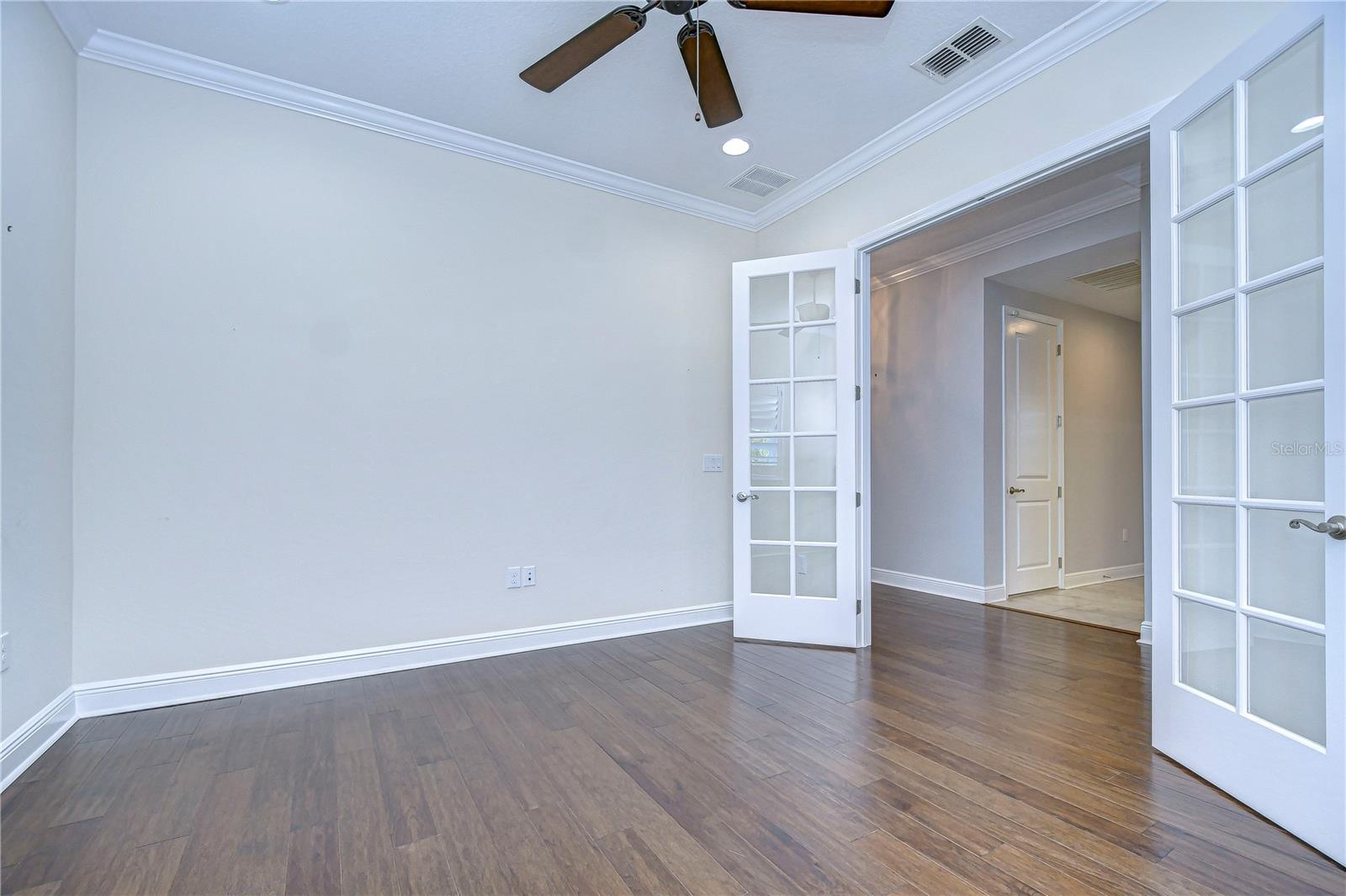 Large office/den space has beautiful double door entryway.