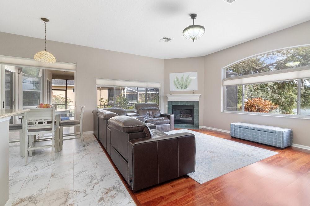 Living room with fireplace and seamless window