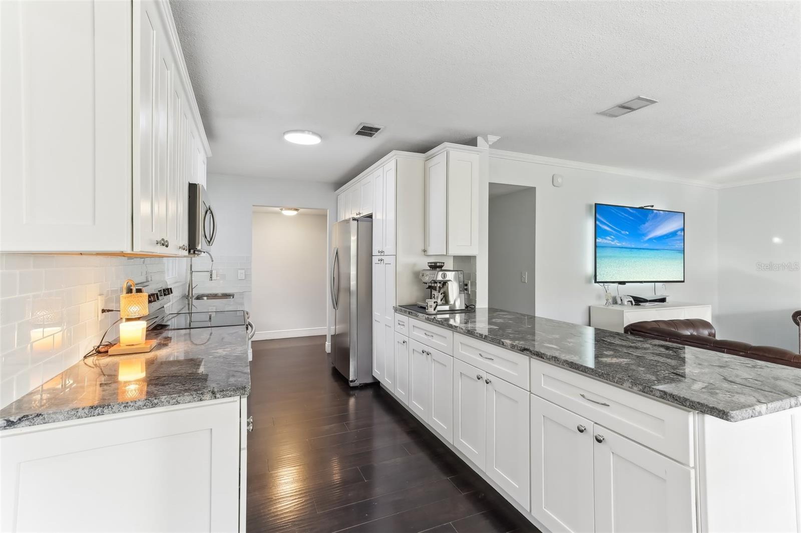 Kitchen open to Dining and Living Room