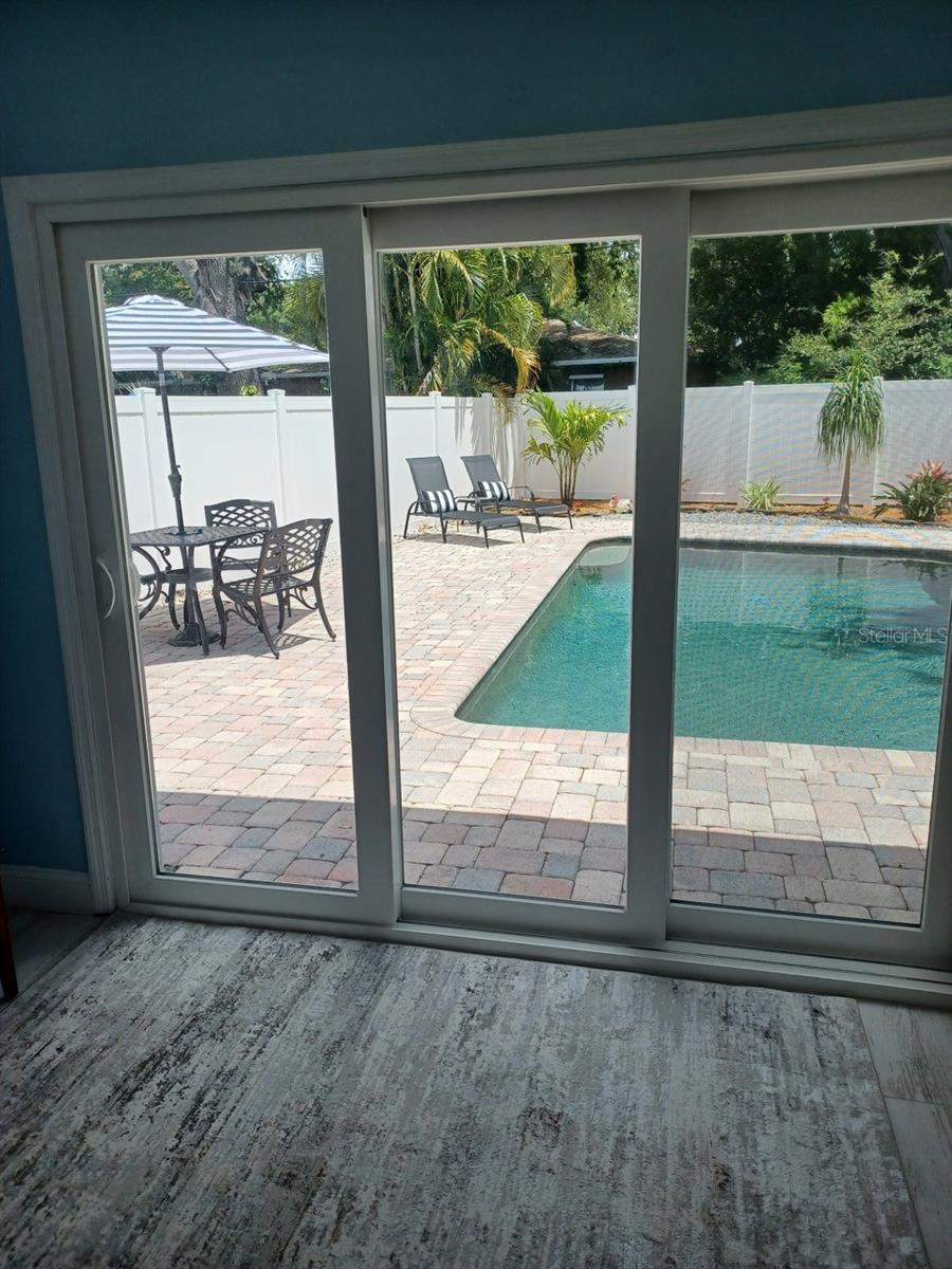 view of pool from master bedroom