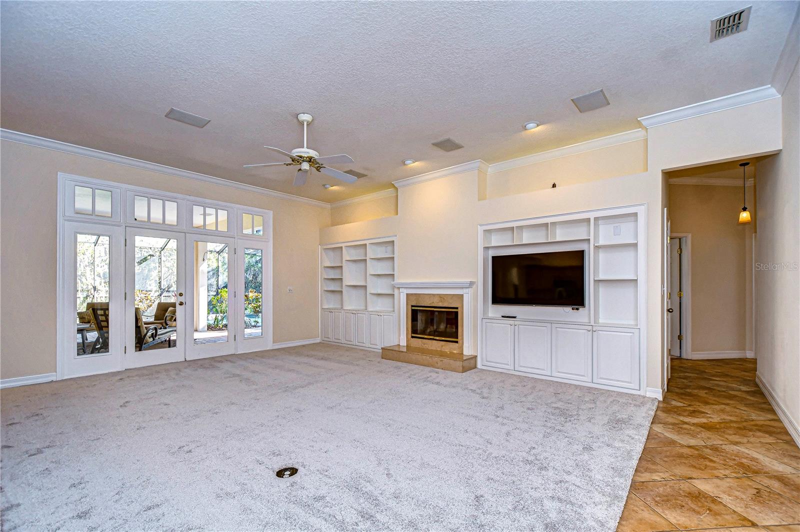 Living area is huge and has french doors leading to the lanai!