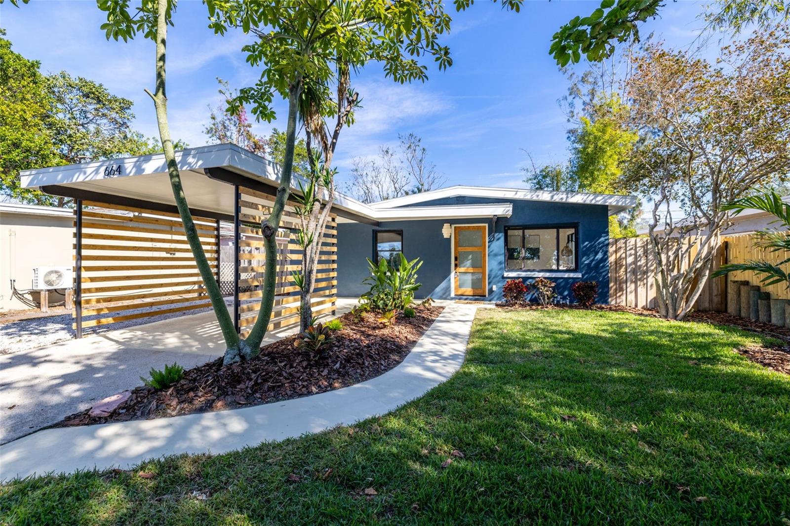 Modern curb appeal and covered carport