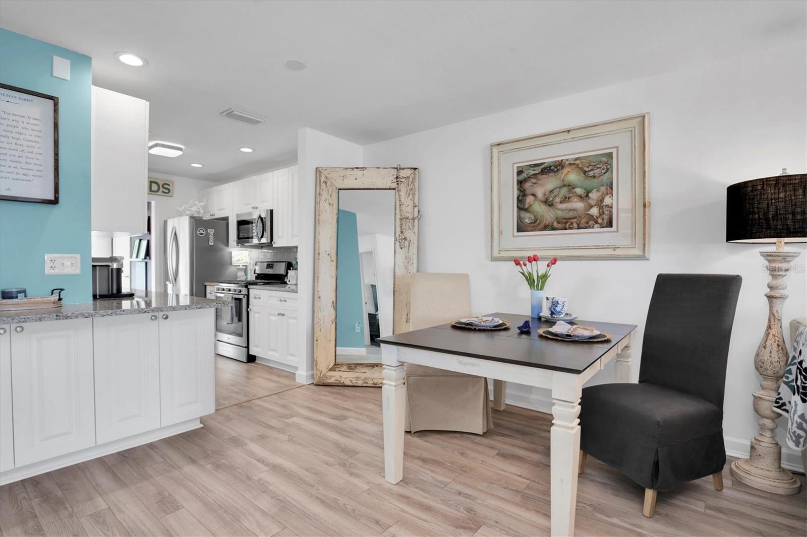 Kitchen leading to bonus sun room