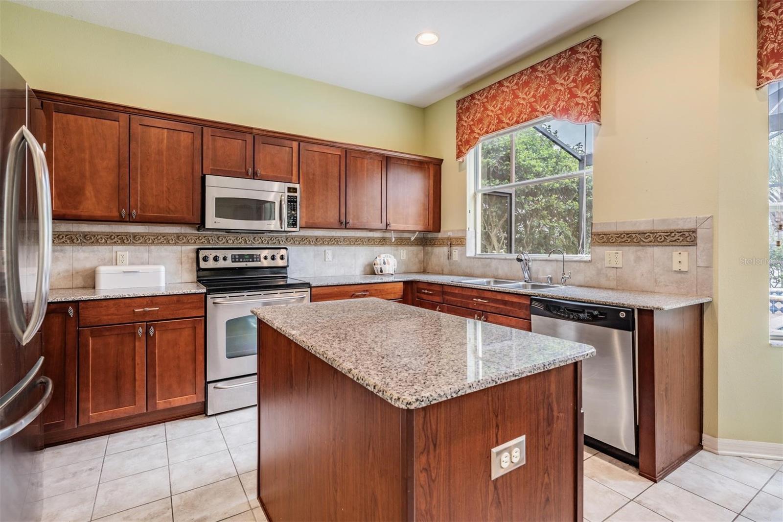 Stone countertops and stainless appliances