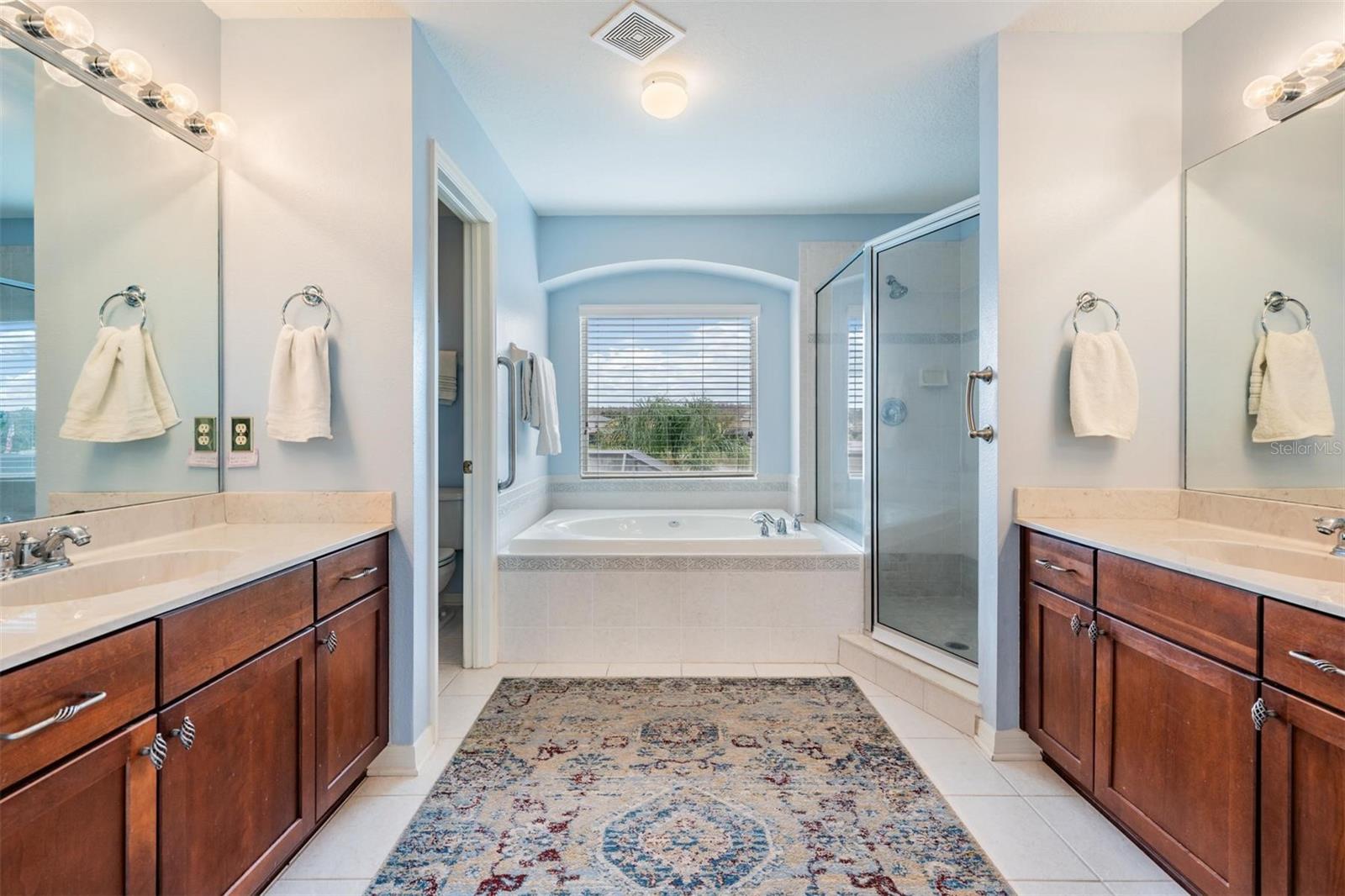 A thoughtful master bathroom layout with a water closet and step in shower