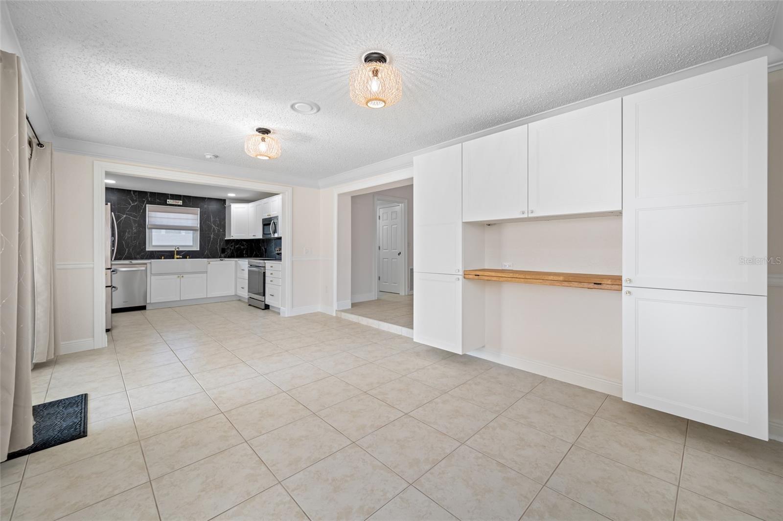 Ample Dining area with custom buid cabinet