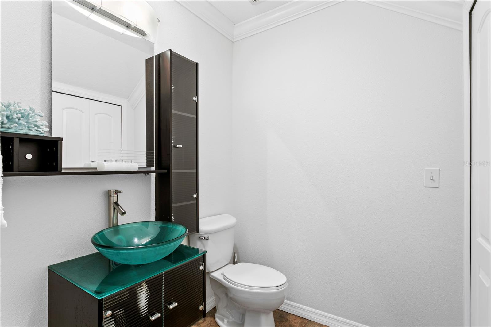 Half bath with laundry closet located off Family Room