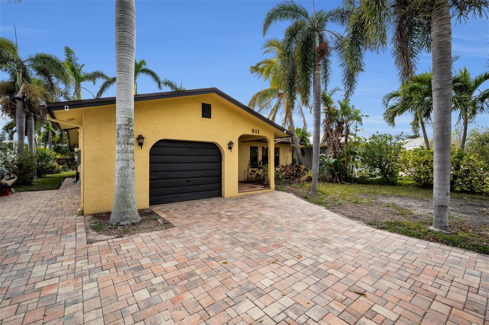 Paver driveway with additional Pavers on the side for boats, watercraft, etc.