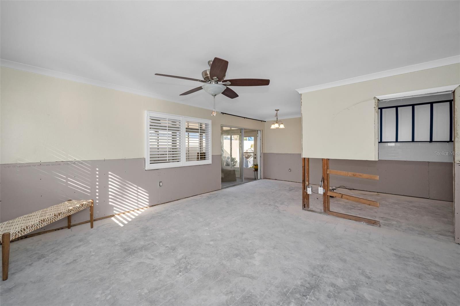 Living Room looking into Dining Room which leads to Enclosed Sun Room