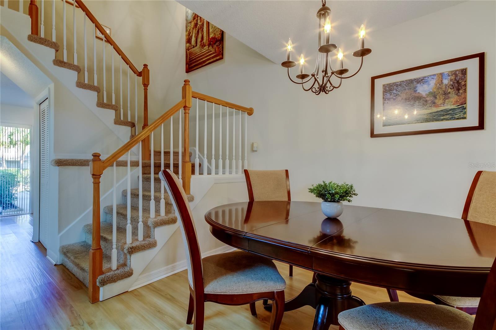 25. Dining Area (9.1' x 10.5') is in a Nook Corner by Stairwell.. Yet Open to Living Room!